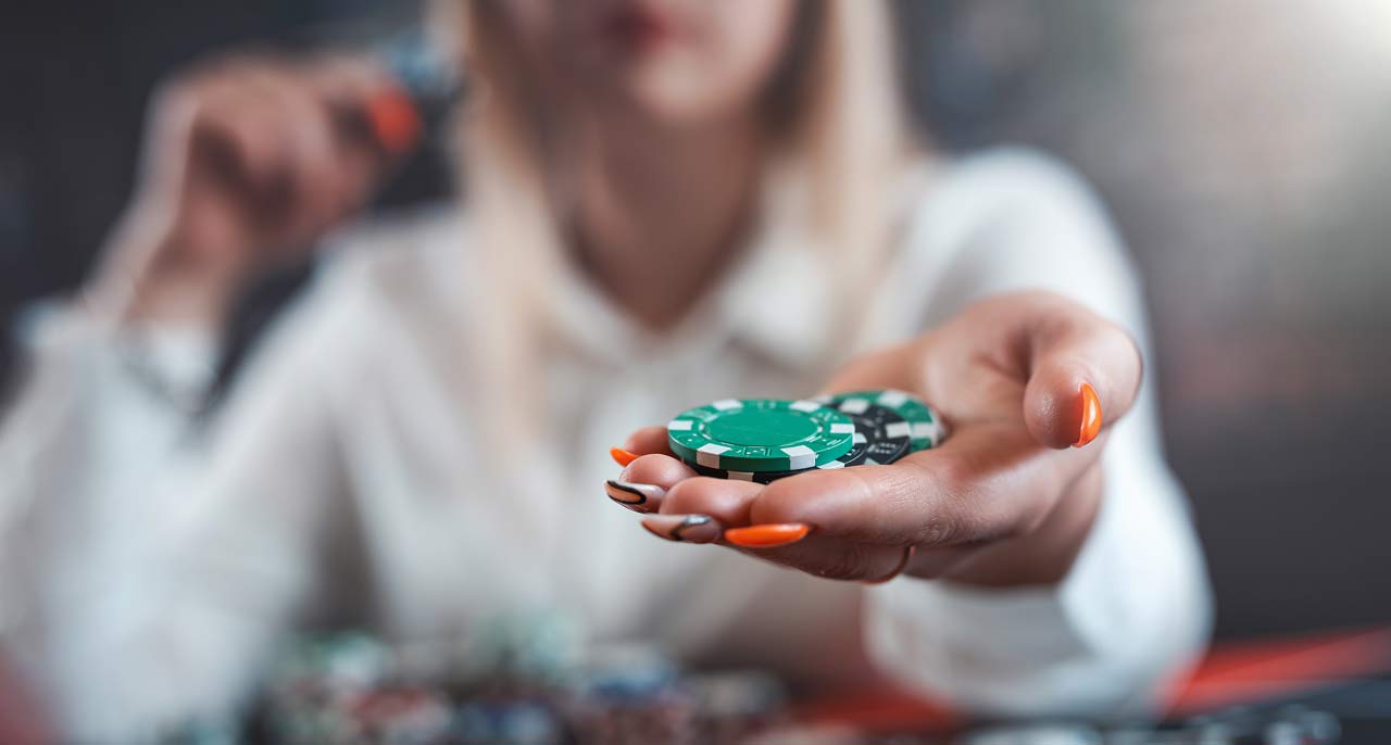 woman player hold poker chips